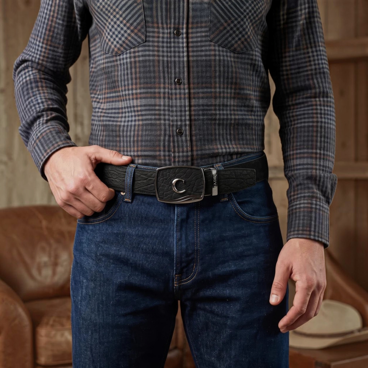 Cowboy City Western Wear black textured bovine leather belt with signature Cuadra C SoloClip buckle worn with jeans