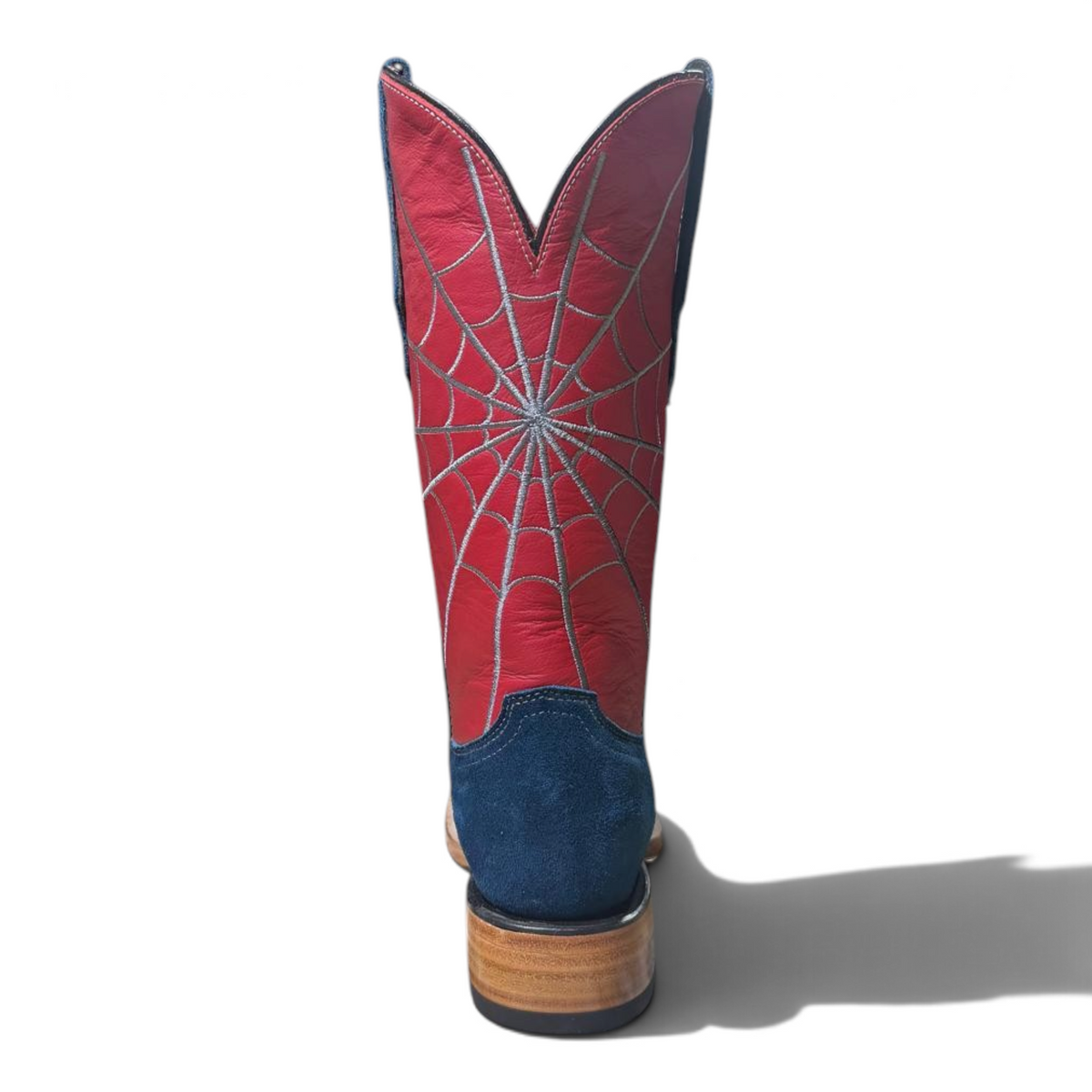 Cowboy City Western Wear blue suede cowboy boots with a red shaft featuring white spiderweb stitching, back view.