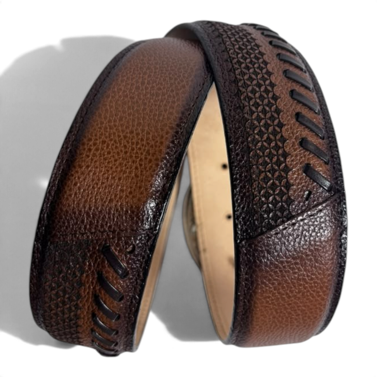 Cowboy City Western Wear brandy leather belt with intricate laser-tooled patterns and dark stitched edge detailing