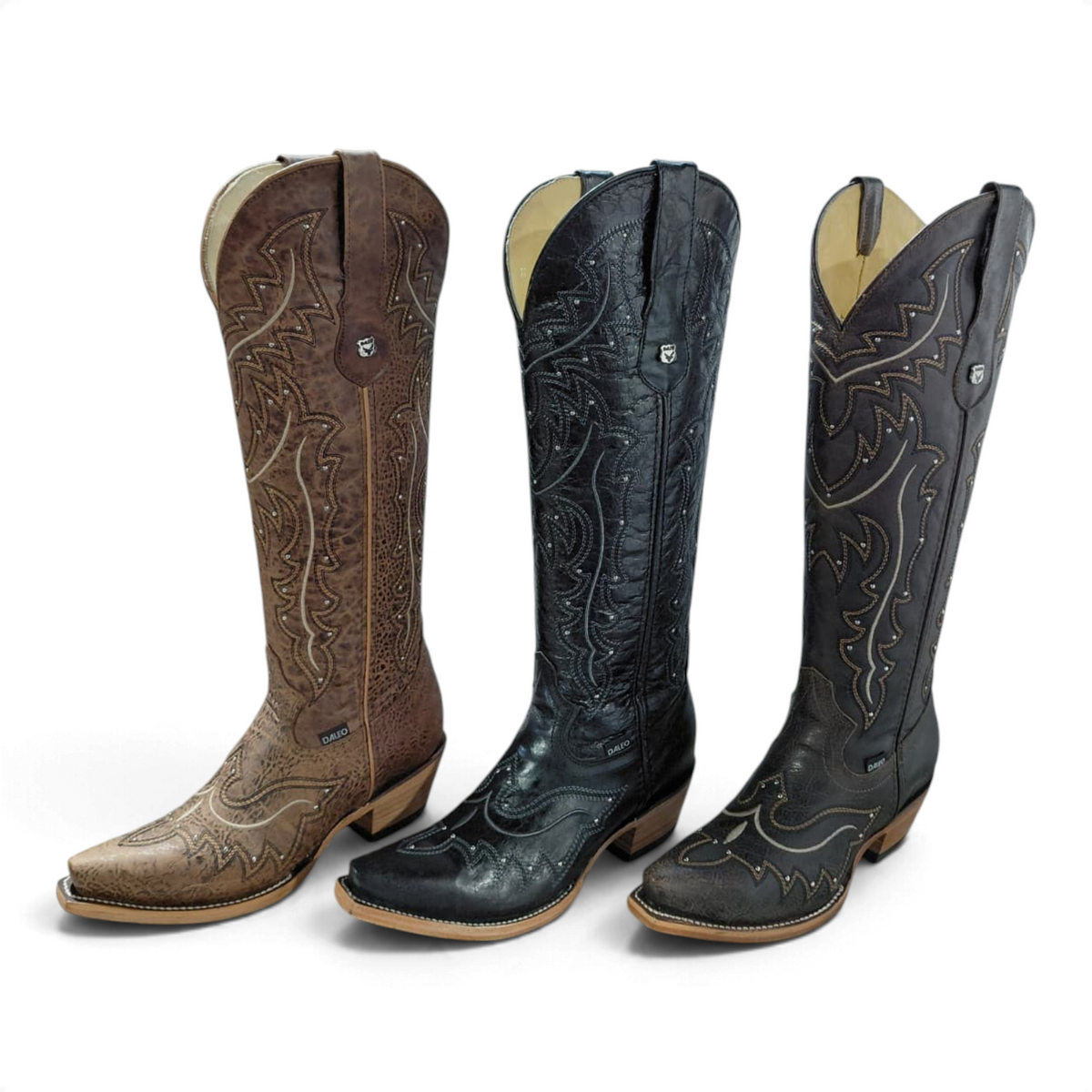 Cowboy City Western Wear Daleo Mayar Roca tall leather western boots in tan, black, and dark brown with snip toes.