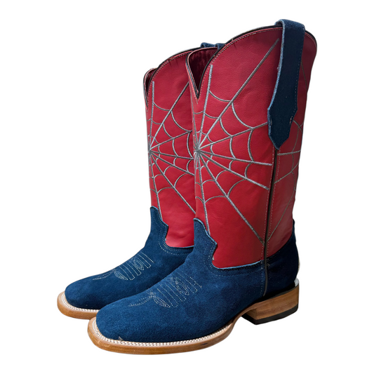 Cowboy City Western Wear blue suede cowboy boots with red shafts featuring white spiderweb stitching and square toes.
