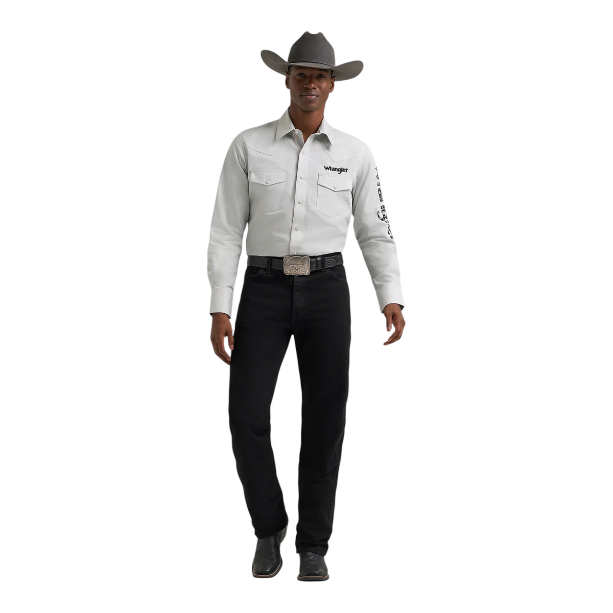 Cowboy City Western Wear model wearing a light grey Wrangler long sleeve snap shirt with logo details and black jeans