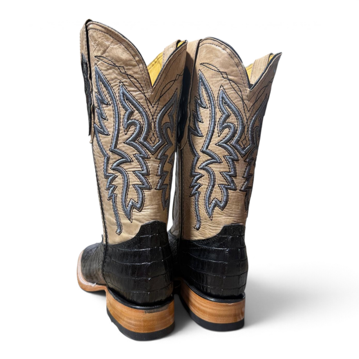Cowboy City Western Wear The Maverick black caiman tail print boots with tan leather shafts and 3D puff stitching.