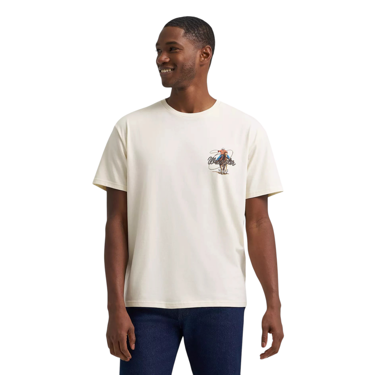 Model wearing a Cowboy City Western Wear Wrangler antique white cotton t-shirt with a Roper Action graphic print.